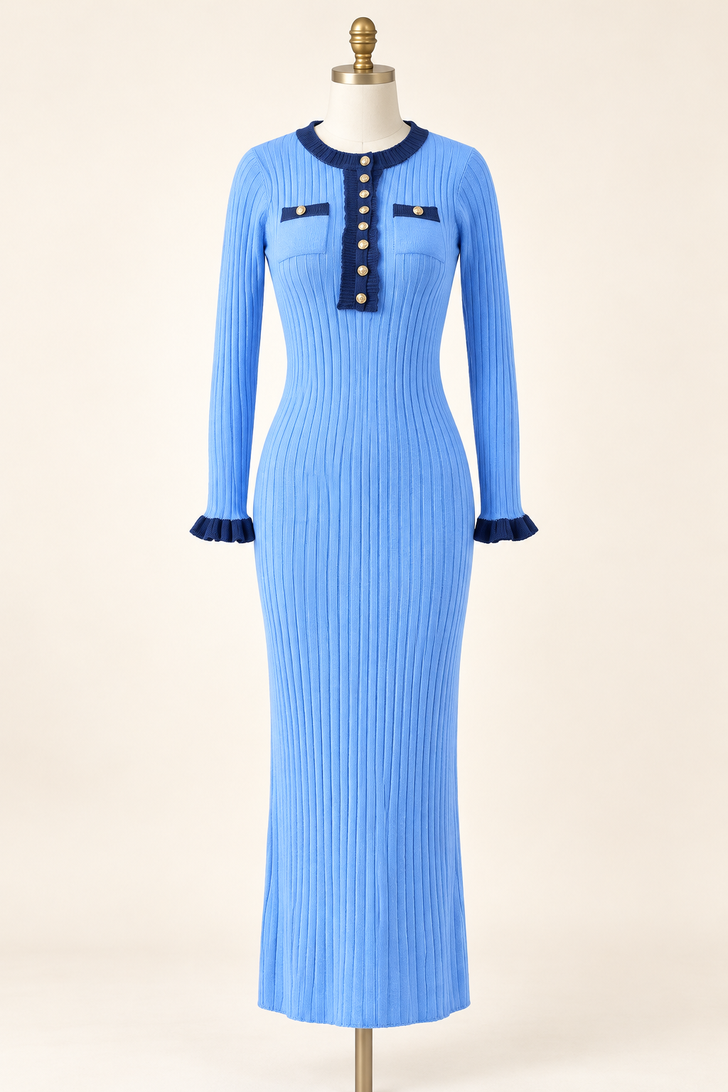 Sky Blue long-sleeve ribbed knit midi dress with navy contrast trim on an ivory studio dress form